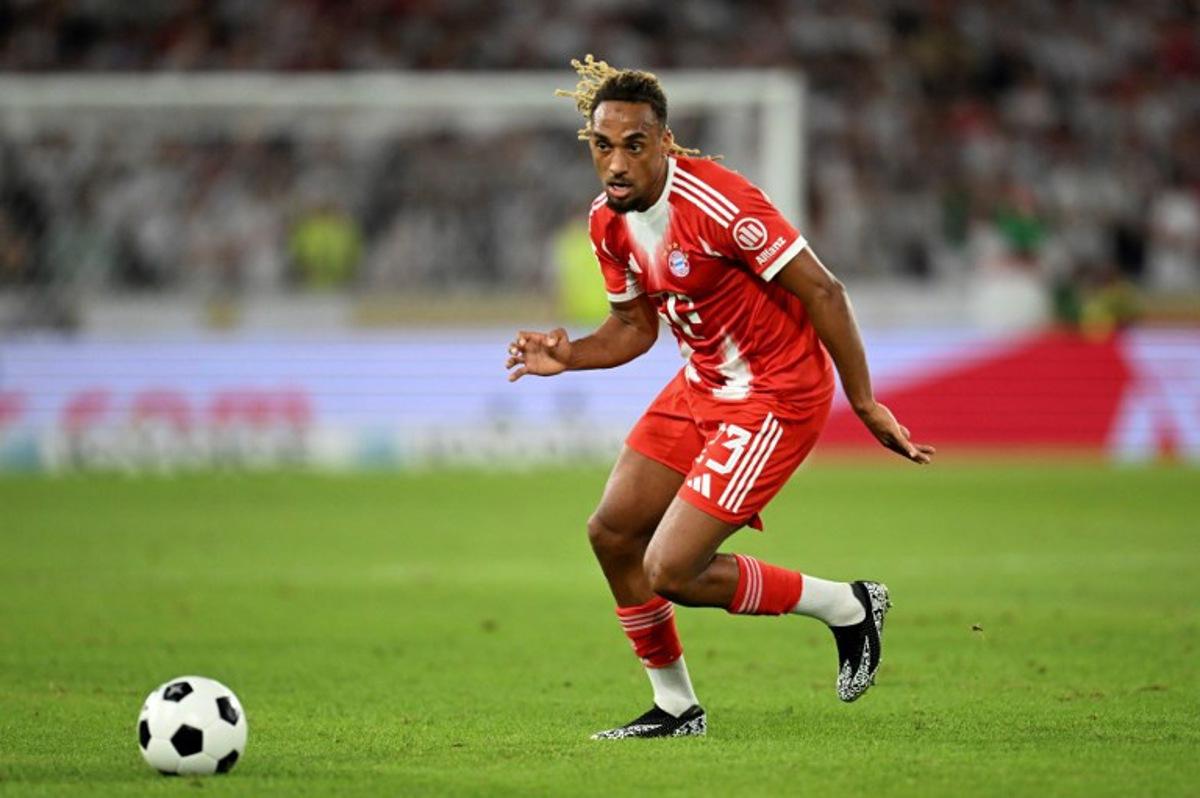Bayern Munich's French defender #23 Sacha Boey controls the ball during the German Supercup football match between VfB Stuttgart and FC Bayern Munich in Stuttgart, southern Germany on August 16, 2025. Bayern Munich won the match 2-1. THOMAS KIENZLE / AFP