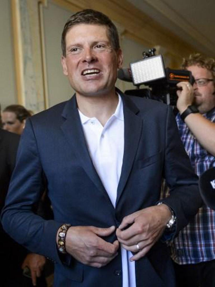 Former German cyclist Jan Ullrich leaves after his appearance before a court in Weinfelden on July 21, 2015 for his involvement in a three-car crash and driving under the influence of alcohol last year. AFP PHOTO / FABRICE COFFRINI