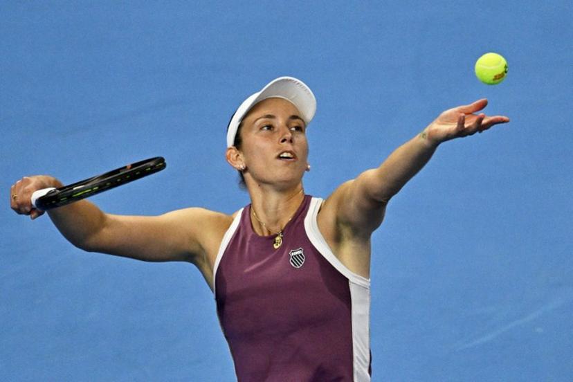 Belgium's Elise Mertens serves to China's Zheng Qinwen during their women's singles semi-final at the China Open tennis tournament in Beijing on October 10, 2026. Pedro PARDO / AFP