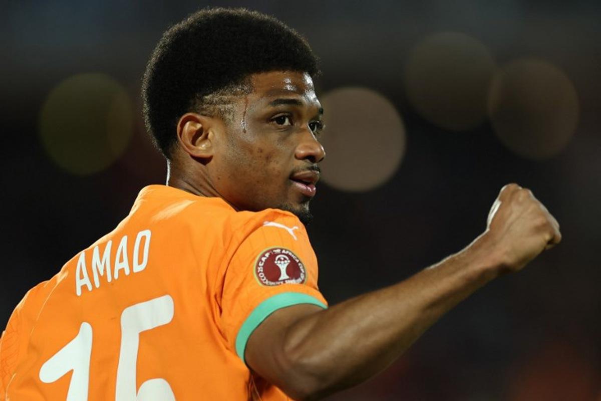 Ivory Coast's forward #15 Amad Diallo celebrates scoring the team's first goal during the Africa Cup of Nations (CAN) round of 16 football match between Ivory Coast and Burkina Faso at the Grand Stadium in Marrakesh on January 6, 2026. FRANCK FIFE / AFP