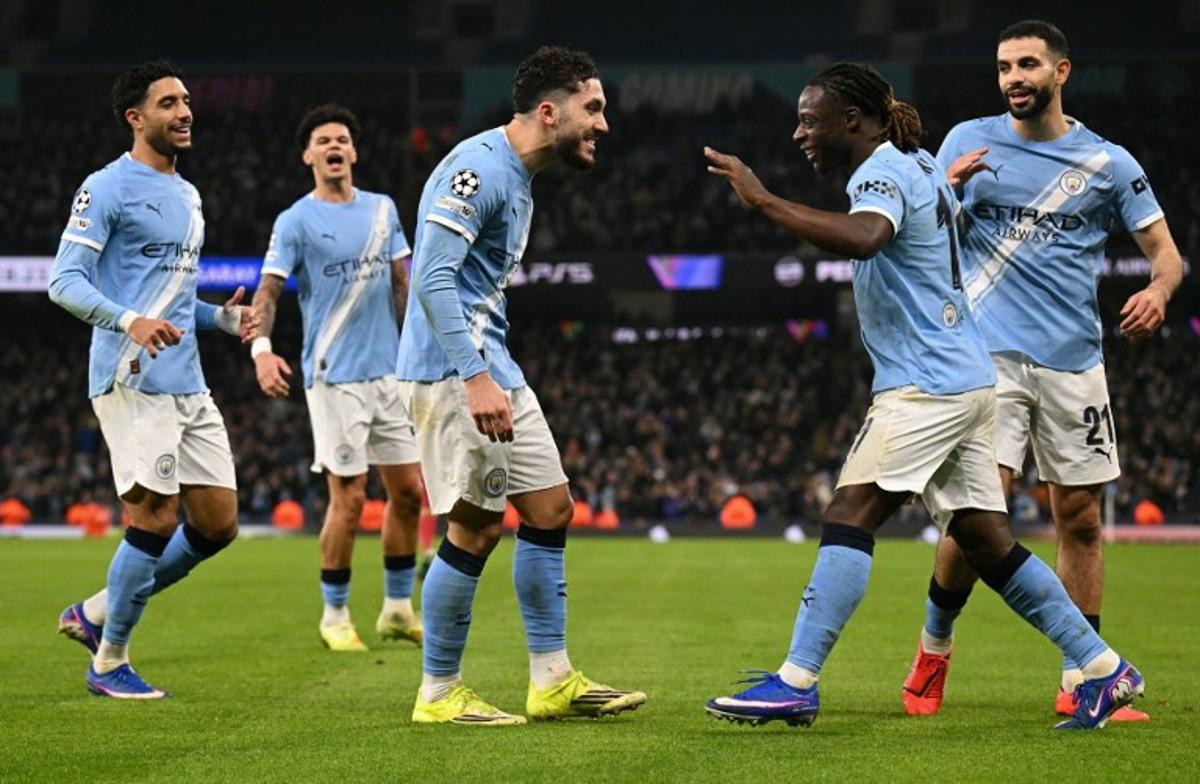 Manchester City's French midfielder #10 Rayan Cherki (C) celebrates scoring the team's second goal with Manchester City's Belgian midfielder #11 Jeremy Doku during the UEFA Champions League football match between Manchester City and Galatasaray at the Etihad Stadium in Manchester, north west England, on January 28, 2026. Oli SCARFF / AFP