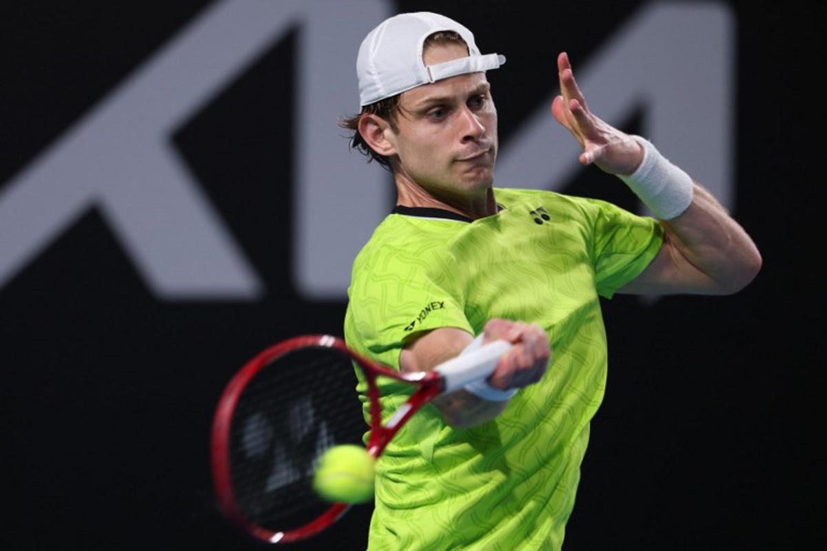 Belgium's Zizou Bergs hits a shot against Poland's Hubert Hurkacz during their men's singles match on day three of the Australian Open tennis tournament in Melbourne on January 20, 2026. IZHAR KHAN / AFP