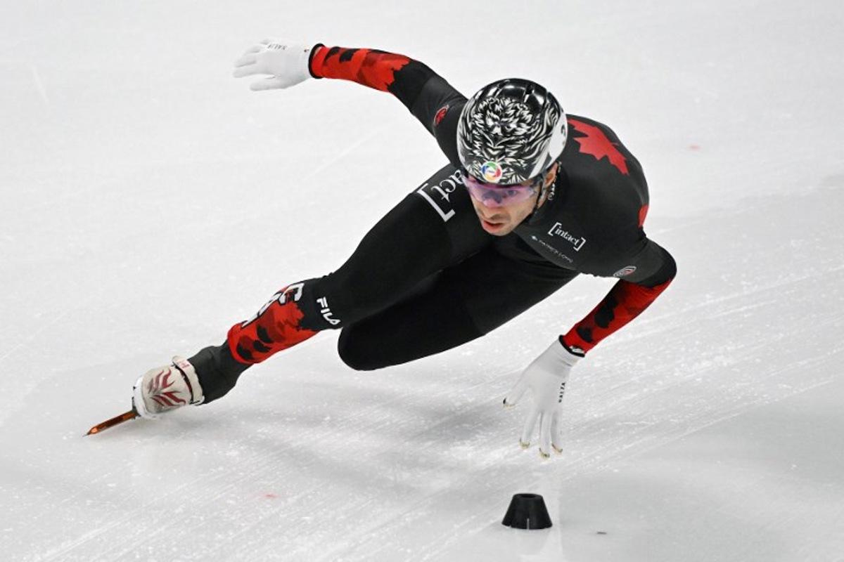 Canada's William Dandjinou competes in the men's 5000m relay final event during the ISU Short Track Championships in Beijing on March 16, 2025. Jade GAO / AFP