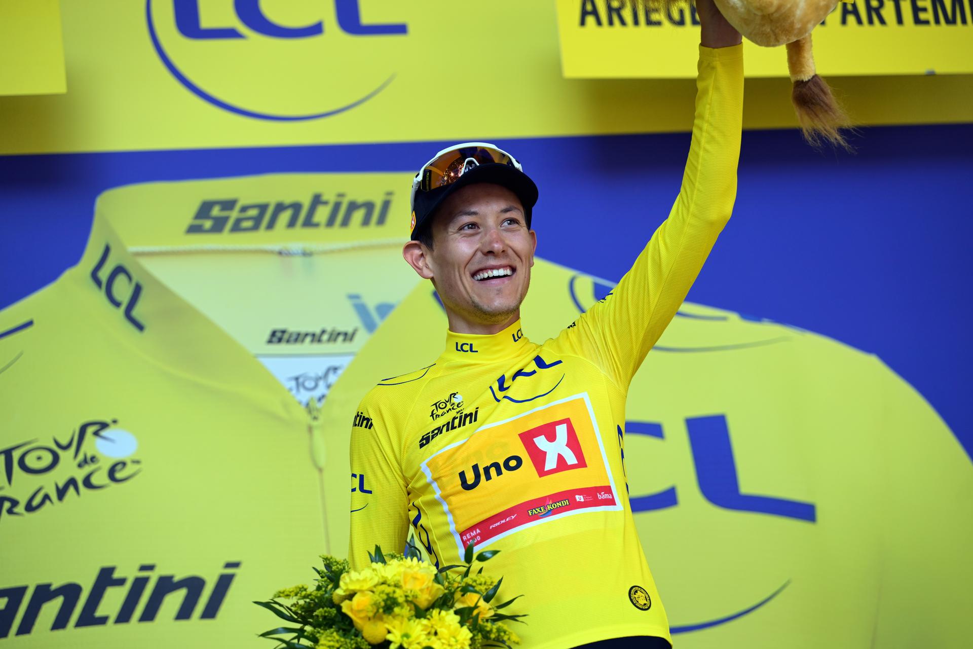 Norwegian Torstein Traeen of Uno-X Mobility celebrates on the podium in the yellow jersey of leader in the overall ranking after stage 4 of the 2026 Tour de France cycling race, a stage of 181,9km from Carcassonne to Foix, on Tuesday 07 July 2026. The 113th edition of the Tour de France starts on Saturday 4 July in Barcelona, Spain, and will finish in Paris, France on the 26th of July. BELGA PHOTO DAVID PINTENS