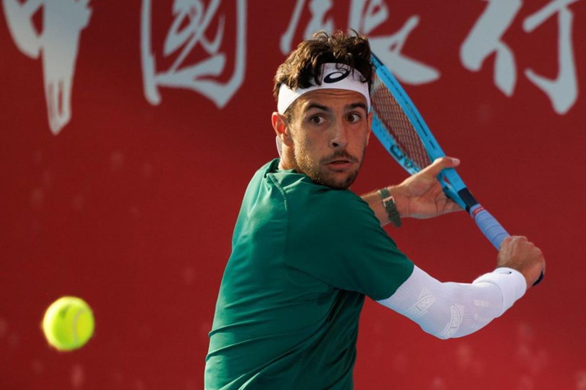 Italy's Lorenzo Musetti hits a return against Russia's Andrey Rublev during their men's singles semi-final match at the Hong Kong Tennis Open in Hong Kong on January 10, 2026. May JAMES / AFP