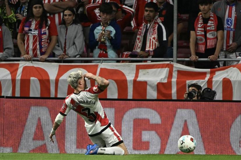 Rayo Vallecano's Spanish defender #03 Pep Chavarria celebrates scoring their first goal during the Spanish league football match between Club Atletico de Madrid and Rayo Vallecano de Madrid at the Metropolitano stadium in Madrid on September 24, 2025. Javier SORIANO / AFP