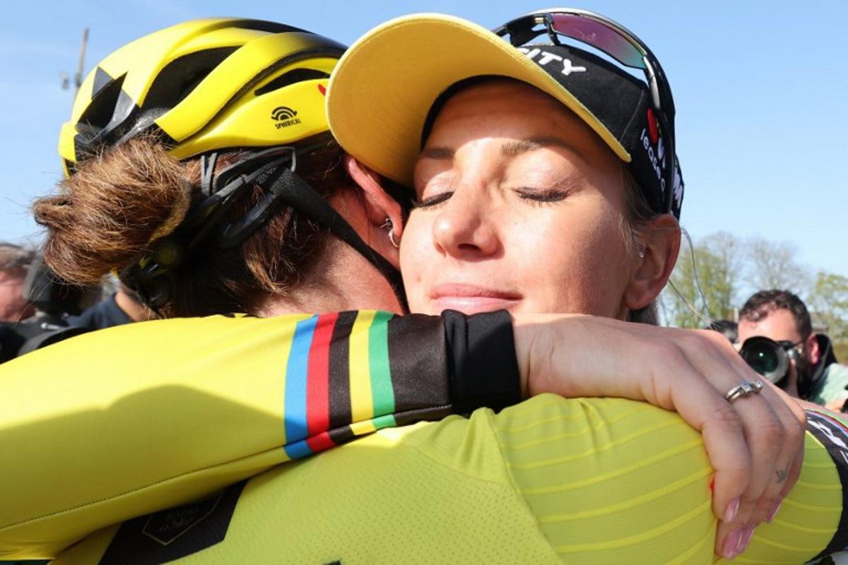 Team Visma-Lease a Bike's French rider Pauline Ferrand Prevot (R) celebrates with Team Visma-Lease a Bike's Dutch rider Marianne Vos (L) after winning the fifth edition of the Paris-Roubaix women's race, 148,5 km between Denain and Roubaix, northern France on April 12, 2025. Francois LO PRESTI / AFP