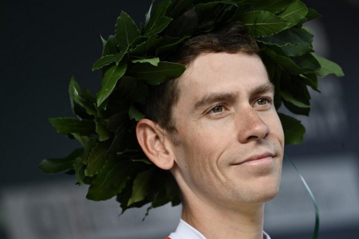 Intermarche-Wanty's South African riderLouis Meintjes looks on from the sign-in podium ahead of the 119th edition of the Giro di Lombardia (Tour of Lombardy), a 238km cycling race from Como to Bergamo on October 11, 2025. Marco BERTORELLO / AFP