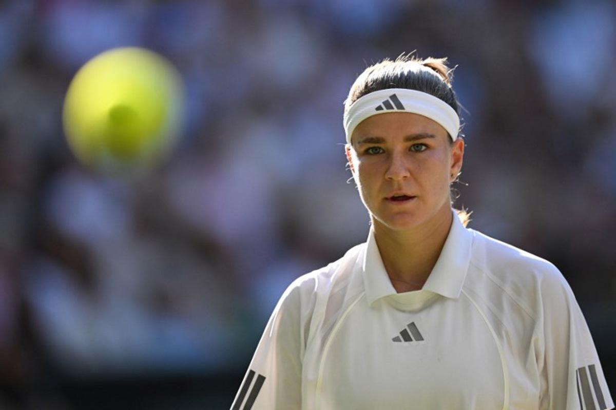 Czech Republic's Karolina Muchova focuses on the ball whilst playing against Czech Republic's Linda Noskova during their women's singles final tennis match on the thirteenth day of the 2026 Wimbledon Championships at The All England Lawn Tennis and Croquet Club in Wimbledon, southwest London, on July 11, 2026. Kirill KUDRYAVTSEV / AFP