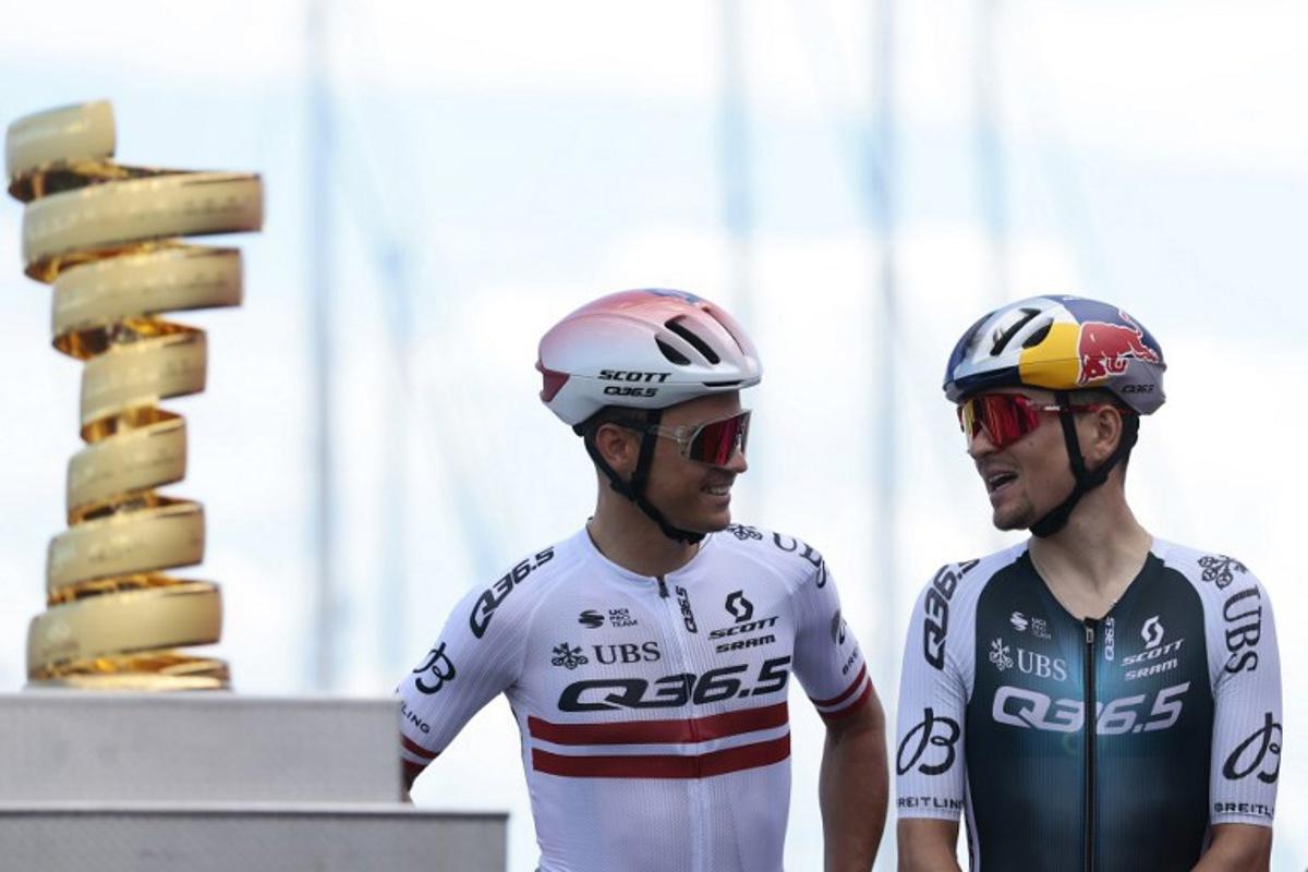 Q36.5 Pro Cycling team's British rider Thomas Pidcock and Q36.5 Pro Cycling team's Latvian rider Emils Liepins are pictured on stage before the 8th stage of the 108th Giro d'Italia cycling race of 197kms from Giulianova to Castelraimondo on May 17, 2025. Luca Bettini / AFP