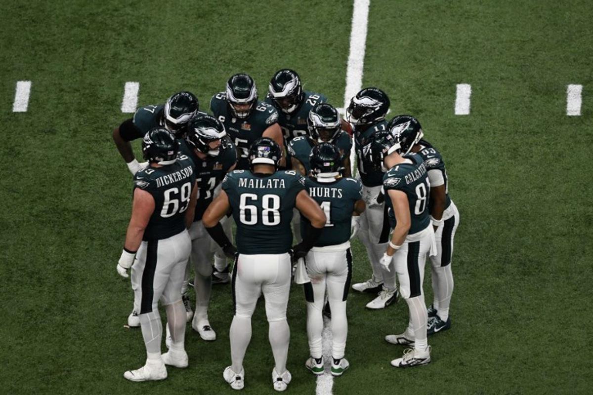 Philadelphia Eagles' quarterback #01 Jalen Hurts gathers the Eagles in the huddle during Super Bowl LIX between the Kansas City Chiefs and the Philadelphia Eagles at Caesars Superdome in New Orleans, Louisiana, February 9, 2025. Chandan Khanna / AFP