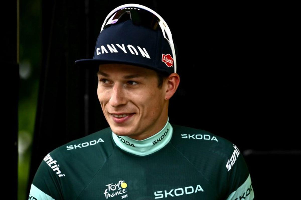 Alpecin - Deceuninck team's Belgian rider Jasper Philipsen celebrates on the podium with the best sprinter's green jersey after the 1st stage of the 112th edition of the Tour de France cycling race, 184.9 km starting and finishing in Lille Metropole, northern France, on July 5, 2025. Marco BERTORELLO / AFP