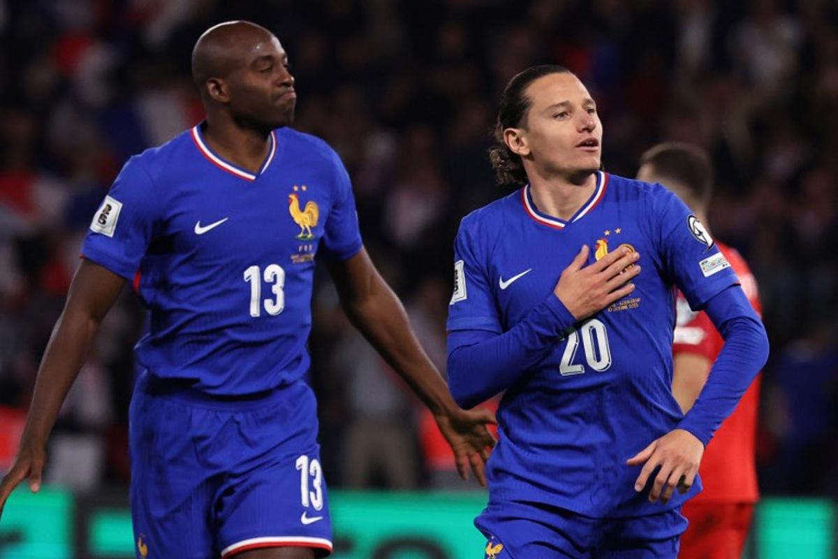France's forward #20 Florian Thauvin (R) celebrates after scoring France's third goal during the FIFA World Cup 2026 Group D European qualification football match between France and Azerbaidjan at the Parc des Princes Stadium in Paris, on October 10, 2025. Anne-Christine POUJOULAT / AFP