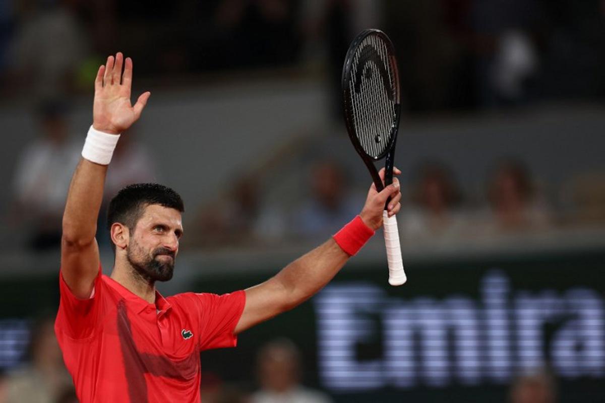 Serbia's Novak Djokovic celebrates his victory over Austria's Filip Misolic during their men's singles match on day 7 of the French Open tennis tournament on Court Philippe-Chatrier at the Roland-Garros Complex in Paris on May 31, 2025. Anne-Christine POUJOULAT / AFP