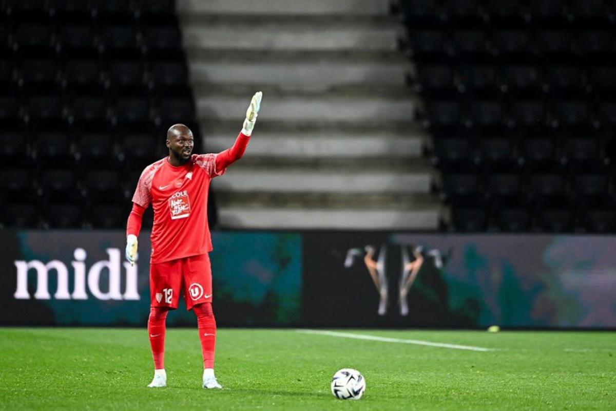 Angers' Burkinabe goalkeeper #12 Herve Koffi gestures during the French L1 football match between SCO Angers and Lille LOSC at the Raymond-Kopa Stadium in Angers, western France, on February 22, 2026. JEAN-FRANCOIS MONIER / AFP