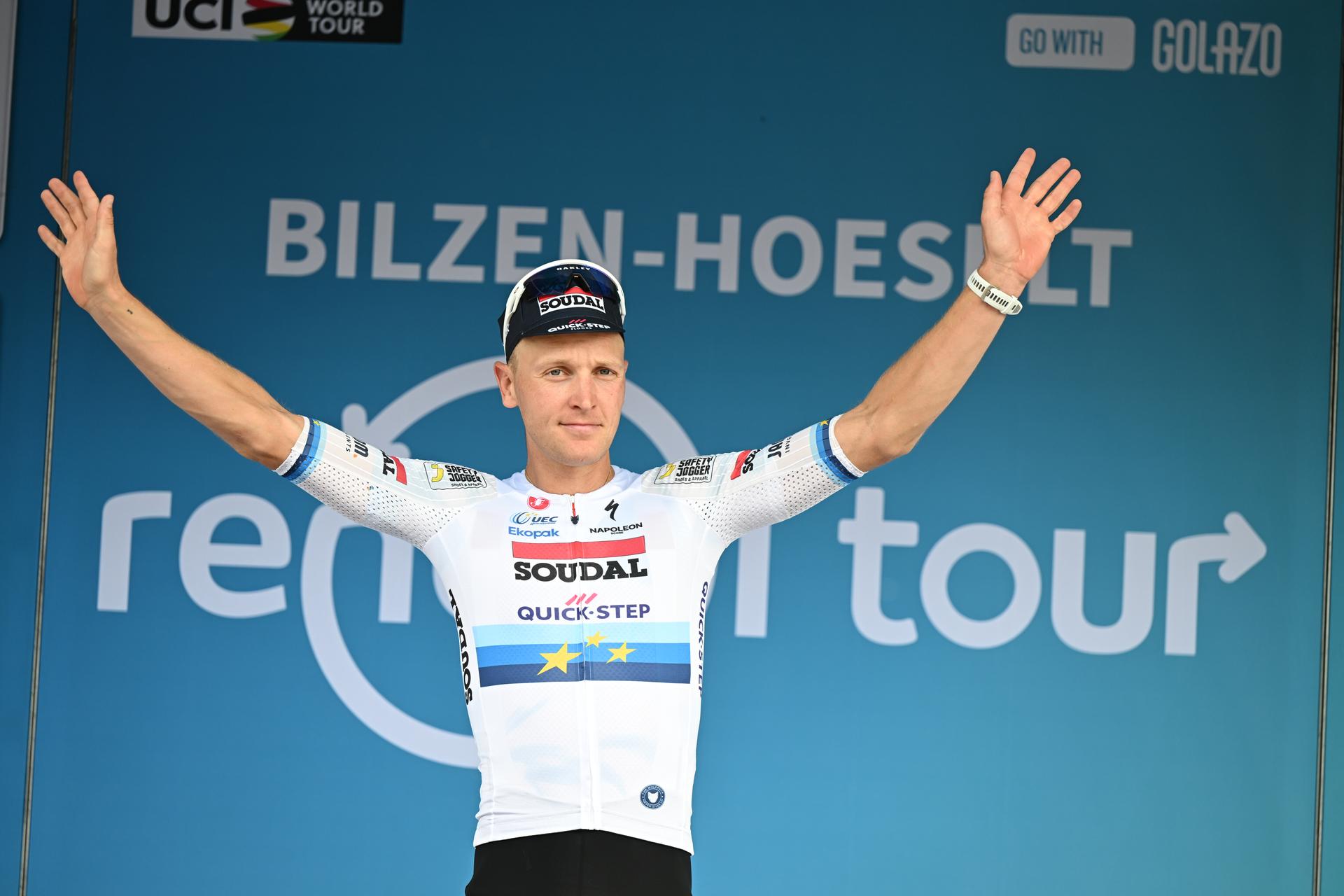 Belgian Tim Merlier of Soudal Quick-Step celebrates on the podium after winning the fourth stage of the 'Renewi Tour' multi-stage cycling race, from Riemst to Bilzen-Hoeselt (196 km) on Saturday 23 August 2025. The five-day race takes place in Belgium and the Netherlands. BELGA PHOTO DAVID PINTENS
