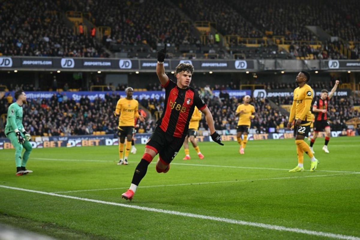 Bournemouth's Hungarian defender #03 Milos Kerkez celebrates scoring the team's second goal during the English Premier League football match between Wolverhampton Wanderers and Bournemouth at the Molineux stadium in Wolverhampton, central England on November 30, 2024. Oli SCARFF / AFP
