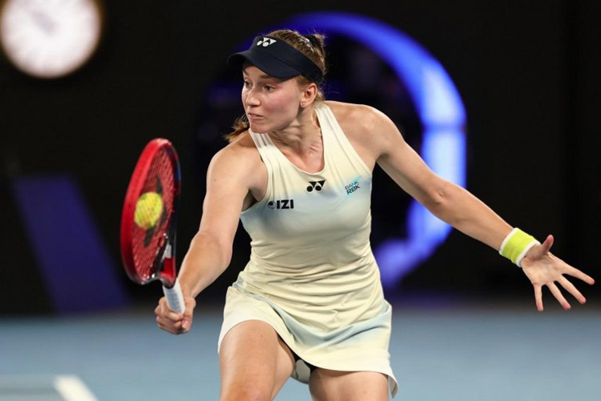 Kazakhstan's Elena Rybakina hits a return against USA's Jessica Pegula during their women's singles semi-final match on day twelve of the Australian Open tennis tournament in Melbourne on January 29, 2026. IZHAR KHAN / AFP