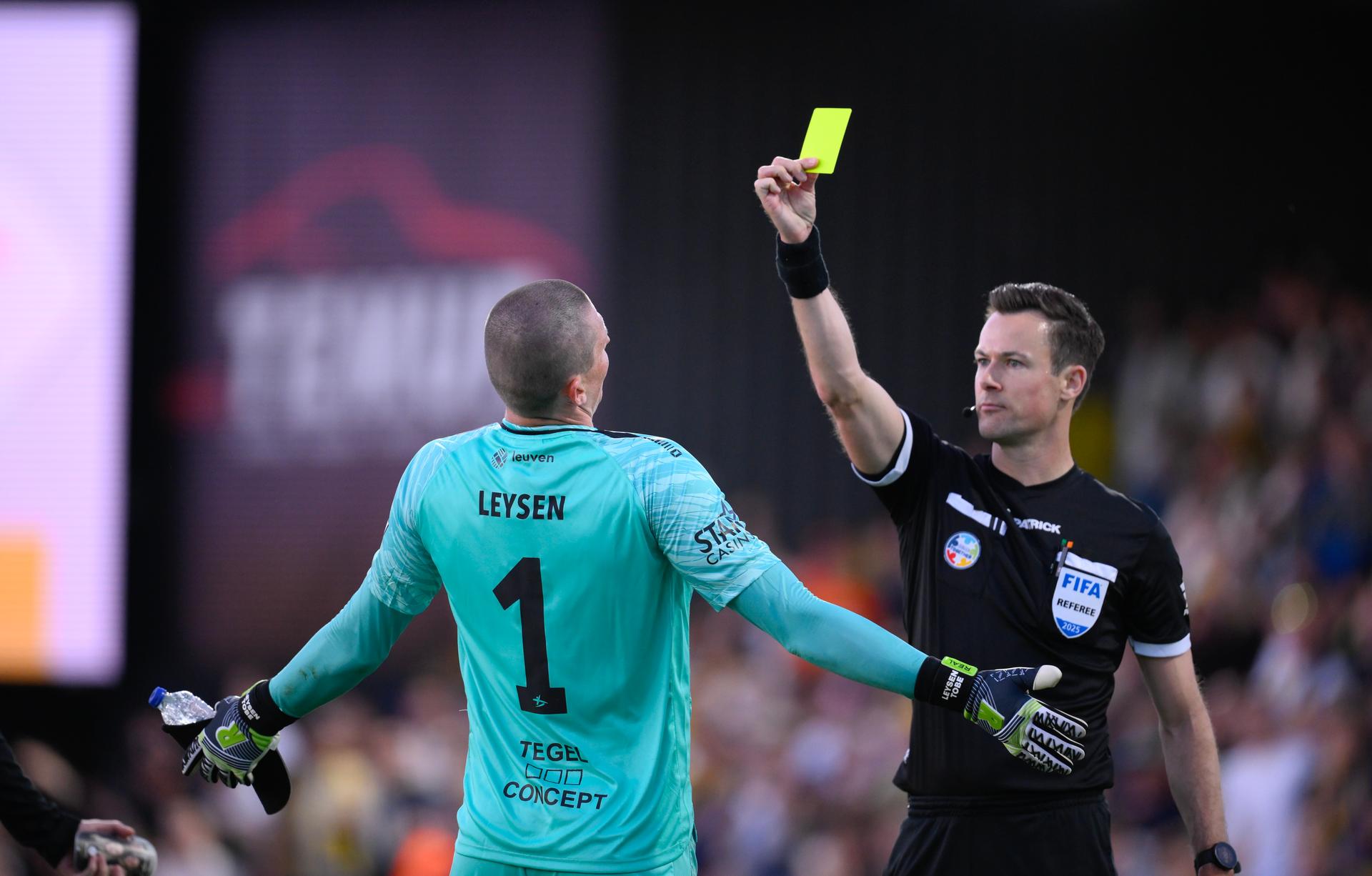OHL's goalkeeper Tobe Leysen receives a yellow card from referee Bram Van Driessche during a soccer match between KVC Westerlo and Oud-Heverlee Leuven, Saturday 05 April 2025 in Westerlo, on day 2 (out of 10) of the Europe Play-offs of the 2024-2025 'Jupiler Pro League' first division of the Belgian championship. BELGA PHOTO JOHN THYS