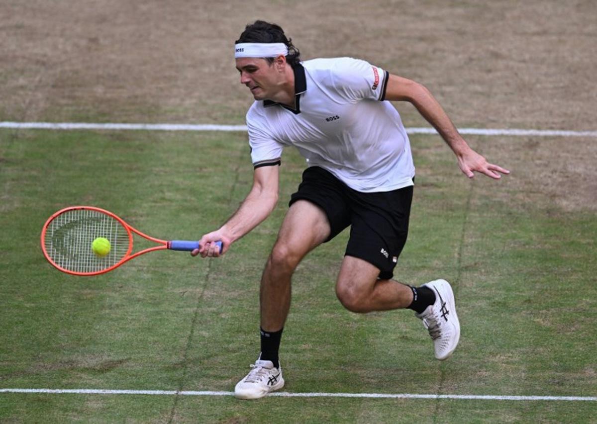 Taylor Fritz of the US returns the ball to Germany's Alexander Zverev during their men's singles semi-final match of the Halle Open ATP tennis tournament in Halle, western Germany, on June 20, 2026. CARMEN JASPERSEN / AFP