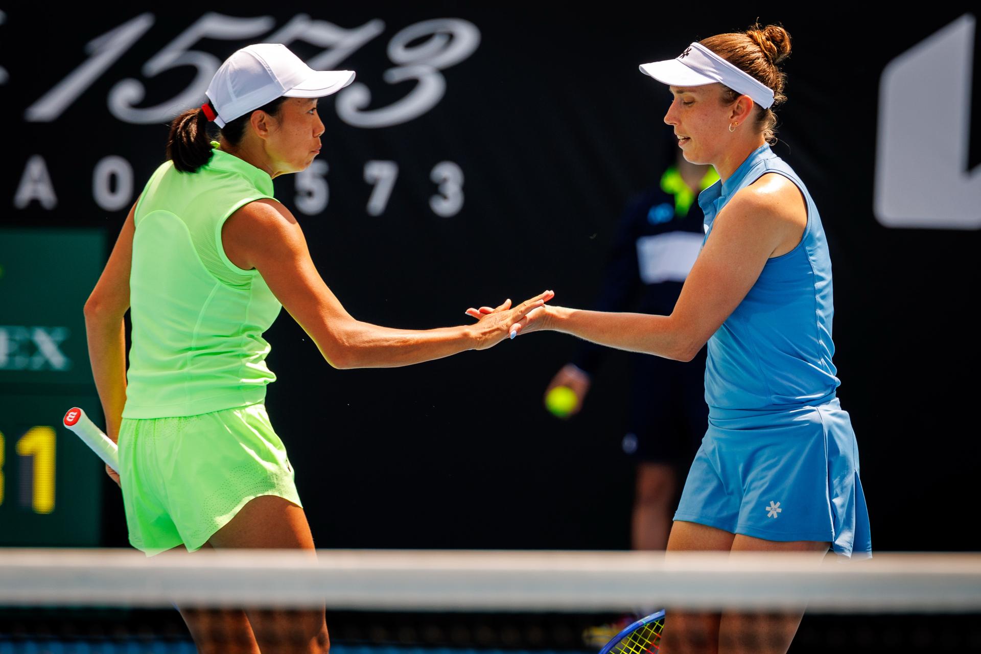 Belgian Elise Mertens (R) and her Chinese partner Shuai Peng celebrate during a doubles tennis match against Taiwanese-Japanese pair Wu-Hozumi, in the quarterfinals of the women doubles at the Australian Open, Melbourne Park, Melbourne on Wednesday 28 January 2026. Mertens - Zhang won the game. BELGA PHOTO PATRICK HAMILTON --- BENELUX ONLY ---