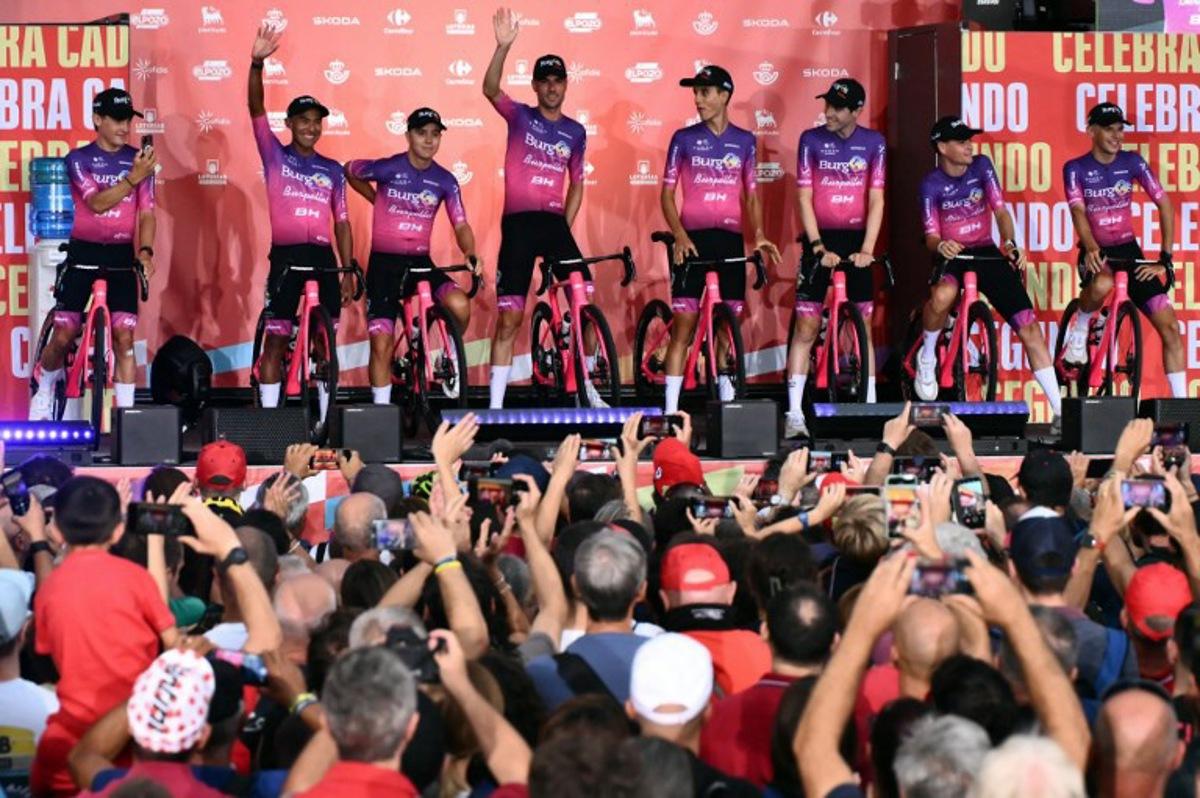 Team Burgos-Burpellet-BH riders wave during the official teams presentation of the 80th edition of 'La Vuelta' cycling tour of Spain, in Torino, Italy on August 21, 2025. Marco BERTORELLO / AFP