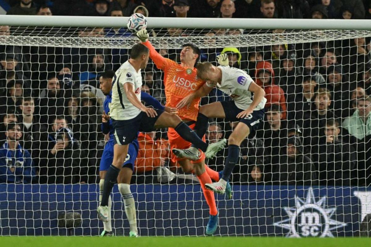 Chelsea's Belgian goalkeeper #39 Mike Penders punches the ball into his own net for an own-goal, Tottenham's opening goal during the English Premier League football match between Chelsea and Tottenham Hotspur at Stamford Bridge in London on October 24, 2026. Glyn KIRK / AFP