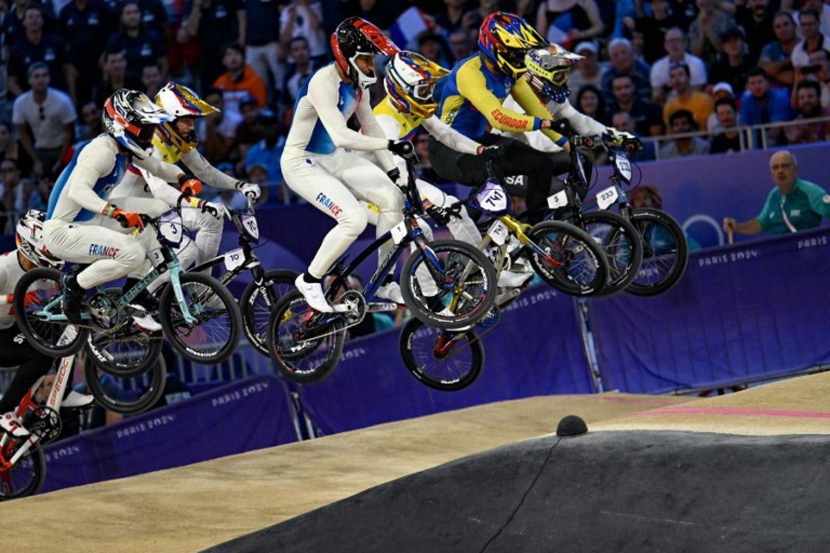 Riders compete in the third run of the Men's Cycling BMX Racing semifinals during the Paris 2024 Olympic Games in Saint-Quentin-en-Yvelines, on August 2, 2024. Mauro PIMENTEL / AFP