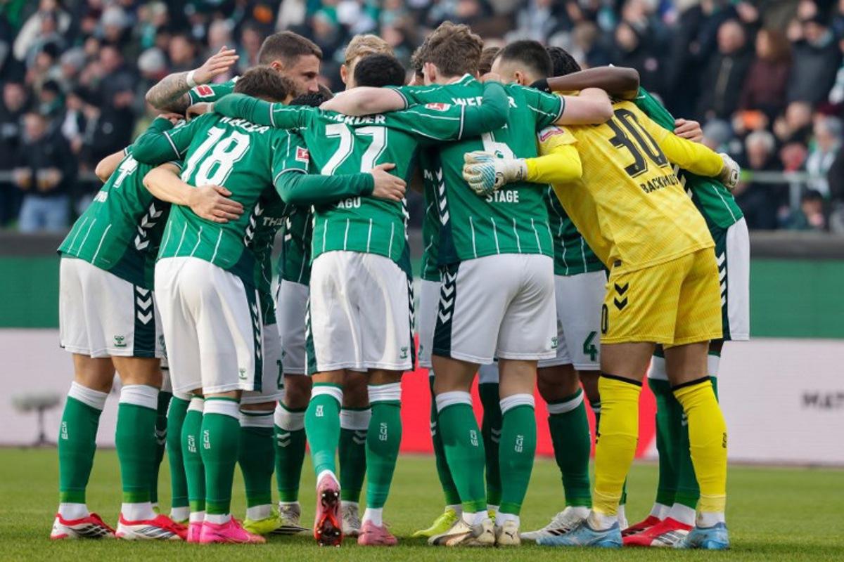 Bremen players make their team huddle prior to the German first division Bundesliga football match between SV Werder Bremen and FC Bayern Munich in Bremen, northern Germany February 14, 2026 Focke Strangmann / AFP