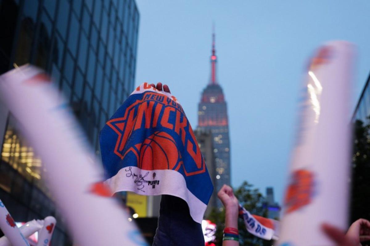 New York Knicks fans watch game 6 of the NBA playoffs against the reigning champions Boston Celtics during a watch party outside Madison Square Garden in New York on May 16, 2025. Leonardo Munoz / AFP