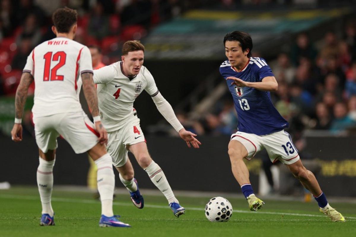 Japan's midfielder Keito Nakamura (R) vies with England's defender Ben White (L) and England's midfielder Elliott Anderson (C) during the friendly international football match between England and Japan at Wembley Stadium in London on March 31, 2026. Adrian Dennis / AFP