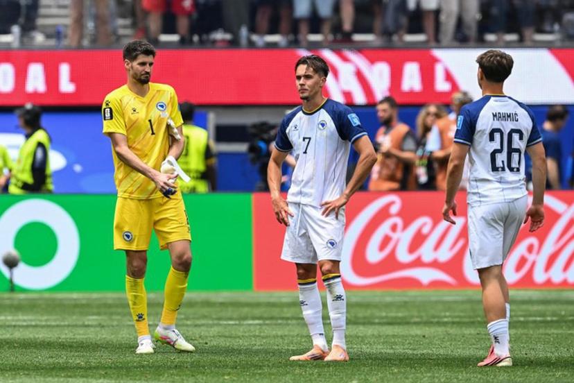 Bosnia-Herzegovina's goalkeeper #01 Nikola Vasilj, defender #07 Amar Dedic, and midfielder #26 Ermin Mahmic react after losing the 2026 World Cup Group B football match between Switzerland and Bosnia and Herzegovina at Los Angeles Stadium in Inglewood on June 18, 2026. Patrick T. Fallon / AFP