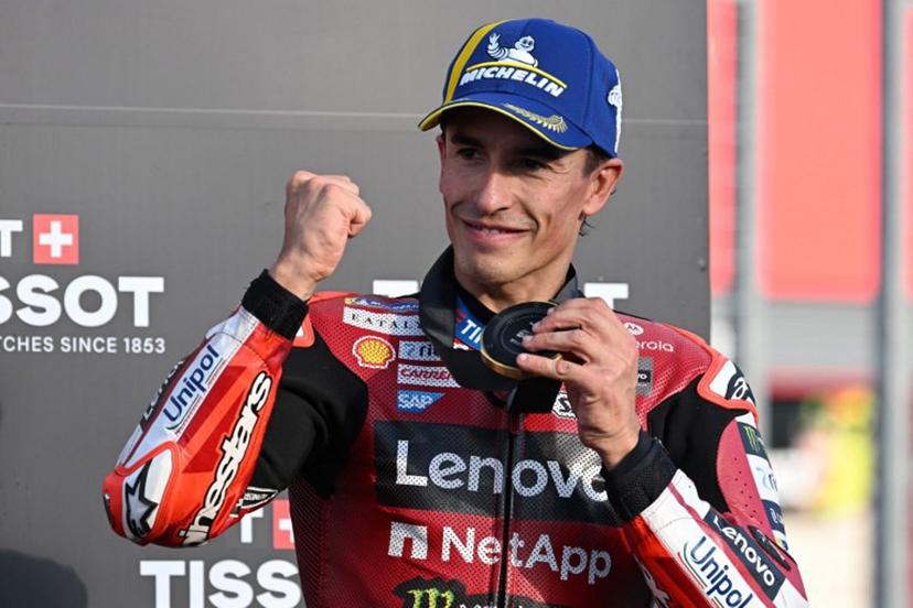 Ducati Lenovo Team rider Marc Marquez of Spain shows off his gold medal on the podium of the sprint race of MotoGP Japanese Grand Prix at the Mobility Resort Motegi in Motegi, Tochigi prefecture on October 3, 2026. Toshifumi KITAMURA / AFP