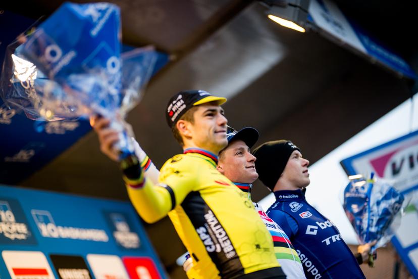 Belgian Wout van Aert, Dutch Mathieu Van Der Poel and Dutch Pim Ronhaar celebrate on the podium after the men's elite race of the 'GP Sven Nys' cyclocross cycling event on Monday 01 January 2024 in Baal, stage 4/8 in the X2O Badkamers 'Trofee Veldrijden' competition. BELGA PHOTO JASPER JACOBS