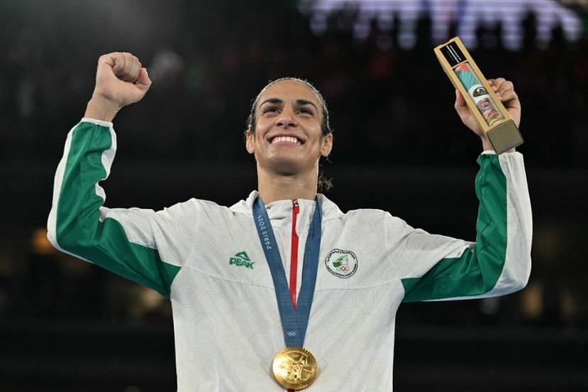 Gold medallist Algeria's Imane Khelif poses on the podium during the medal ceremony for the women's 66kg final boxing category during the Paris 2024 Olympic Games at the Roland-Garros Stadium, in Paris on August 9, 2024. MOHD RASFAN / AFP