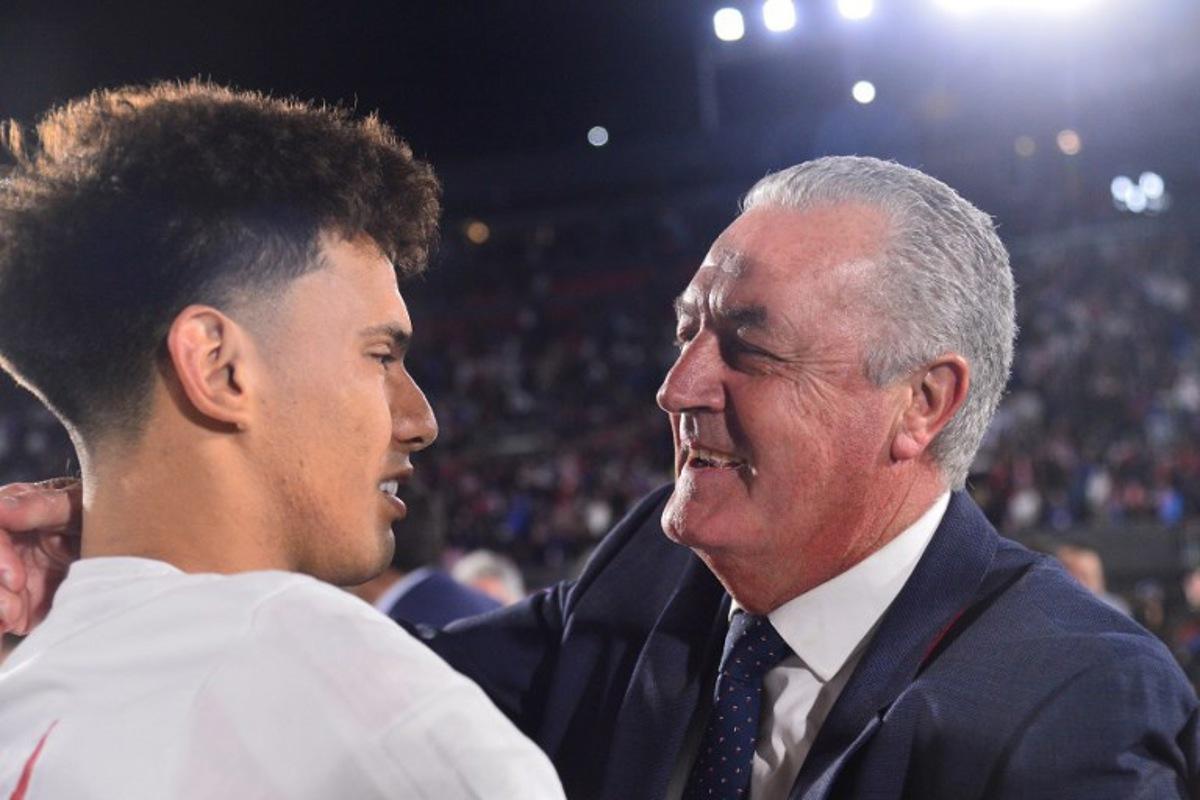 Paraguay's Argentine head coach Gustavo Alfaro (R) celebrates after the 2026 FIFA World Cup South American qualifiers football match between Paraguay and Ecuador at the Defensores del Chaco stadium in Asuncion on September 4, 2025. Daniel DUARTE / AFP