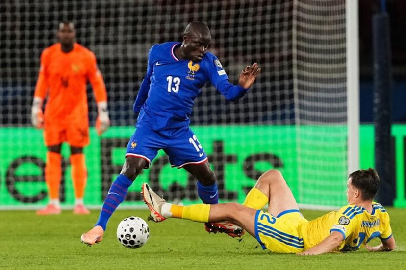 France's midfielder #13 N'Golo Kante (L) fights for the ball with Ukraine's defender #22 Taras Mykhavko during the 2026 World Cup qualifiers Europe zone group D football match between France and Ukraine at the Parc des Princes stadium in Paris, on November 13, 2025. Dimitar DILKOFF / AFP