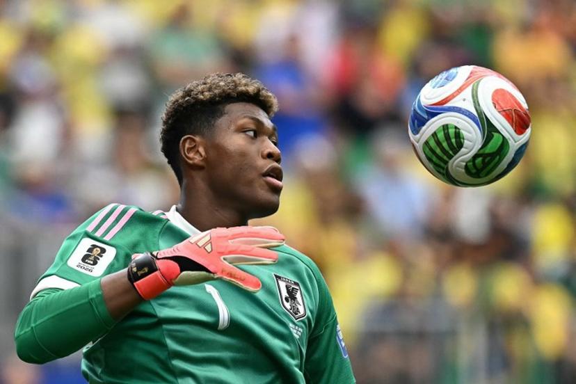 (FILES) Japan's goalkeeper Zion Suzuki eyes the ball during the 2026 World Cup round of 32 football match between Brazil and Japan at the Houston Stadium in Houston on June 29, 2026. Zion Suzuki has had to overcome costly mistakes and racist abuse on the way to becoming the most expensive Japanese goalkeeper in history. The 23-year-old is reportedly set to join Premier League Aston Villa from Italian team Parma for up to 35 million euros ($40 million) following an impressive World Cup. Paul ELLIS / AFP