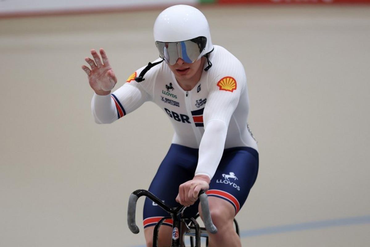 Great Britain's #121 Matthew Richardson celebrates winning silver in the men's sprint final at the 2025 UCI Track World Championships, in the Penalolen Velodrome in Santiago, on October 26, 2025. Javier TORRES / AFP