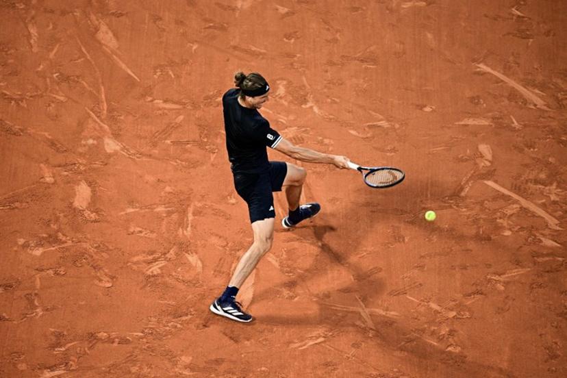 Germany's Alexander Zverev plays a forehand return to Czech Republic's Tomas Machac during their men's singles match on day 4 of the French Open tennis tournament on Court Philippe-Chatrier at the Roland-Garros Complex in Paris on May 27, 2026. JULIEN DE ROSA / AFP
