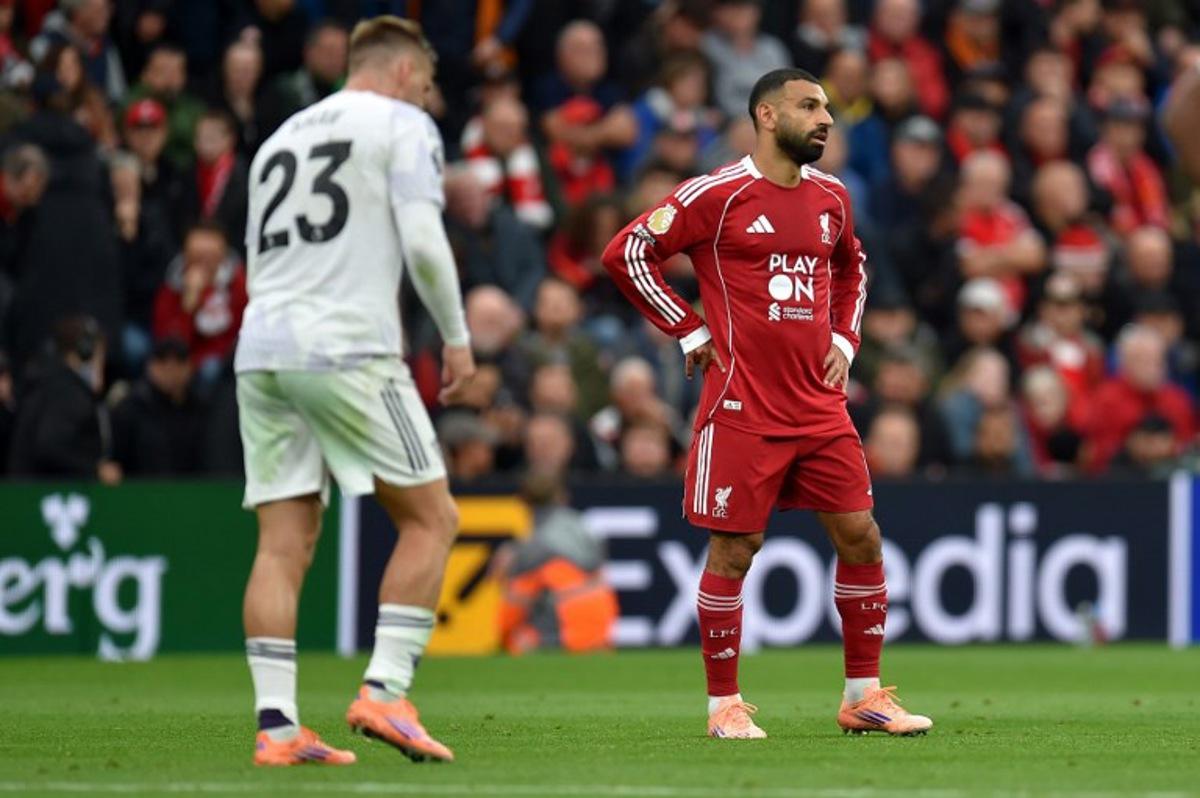 Liverpool's Egyptian striker #11 Mohamed Salah reacts during the English Premier League football match between Liverpool and Manchester United at Anfield in Liverpool, north west England on October 19, 2025. PETER POWELL / AFP