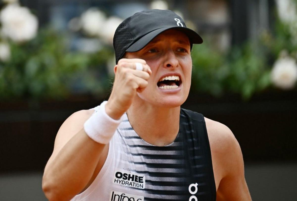 Poland's Iga Swiatek celebrates after winning against USA's Jessica Pegula during the ATP Rome Open tennis tournament at Foro Italico in Rome on May 13, 2026. Filippo MONTEFORTE / AFP