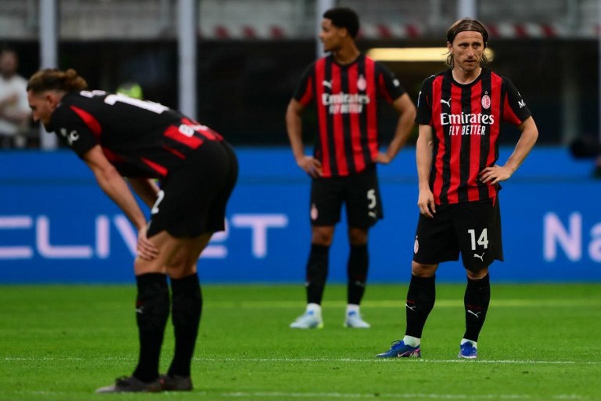 AC Milan Croatian midfielder #14 Luka Modrić (R) reacts during the Italian Serie A football match between AC Milan and Udinese at the San Siro stadium in Milan, northern Italy, on April 11, 2026. MARCO BERTORELLO / AFP
