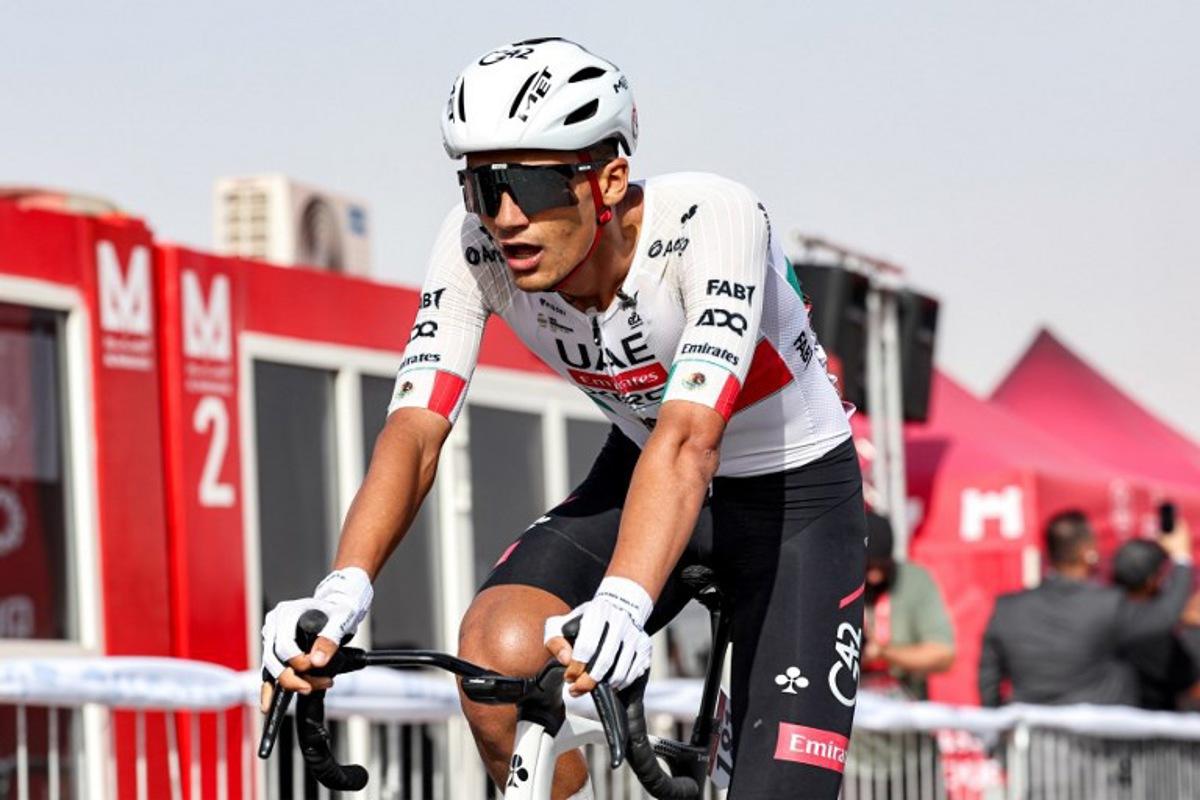 UAE Team Emirates's Mexican rider Isaac Del Toro Romero looks on after winning the first stage of the UAE Tour cycling event from Madinat Zayed Majlis to Liwa Palace in Abu Dhabi on February 16, 2026. Fadel SENNA / AFP