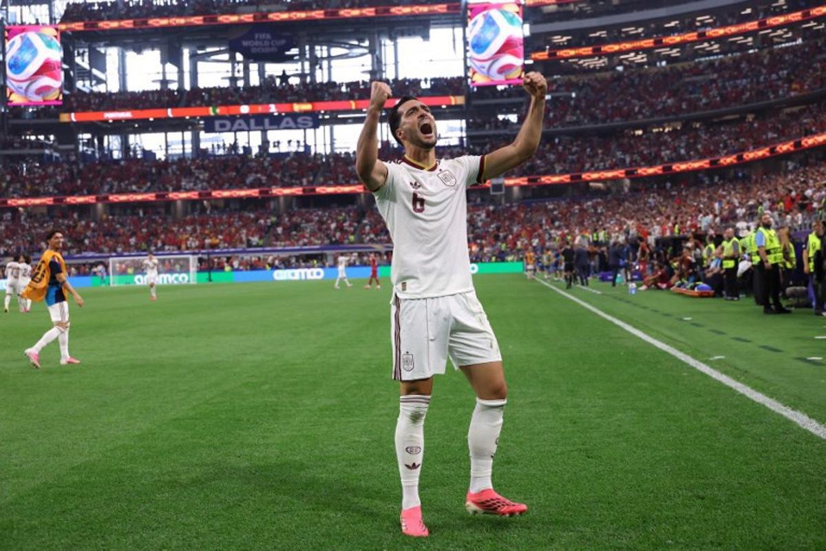 Spain's midfielder #06 Mikel Merino celebrates scoring his team's first goal during the 2026 World Cup round of 16 football match between Portugal and Spain at the Dallas Stadium in Arlington on July 6, 2026. Thomas COEX / AFP