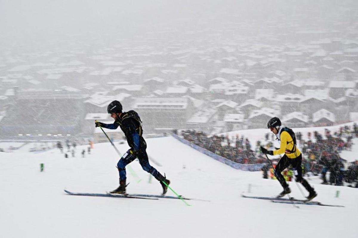Individual Neutral Athletes' Nikita Filippov (L) and Belgium's Maximilien Drion Du Chapois compete in the men's sprint ski mountaineering heat 2 during the Milano Cortina 2026 Winter Olympic Games at the Stelvio Ski Centre in Bormio (Valtellina) on February 19, 2026. Fabrice COFFRINI / AFP