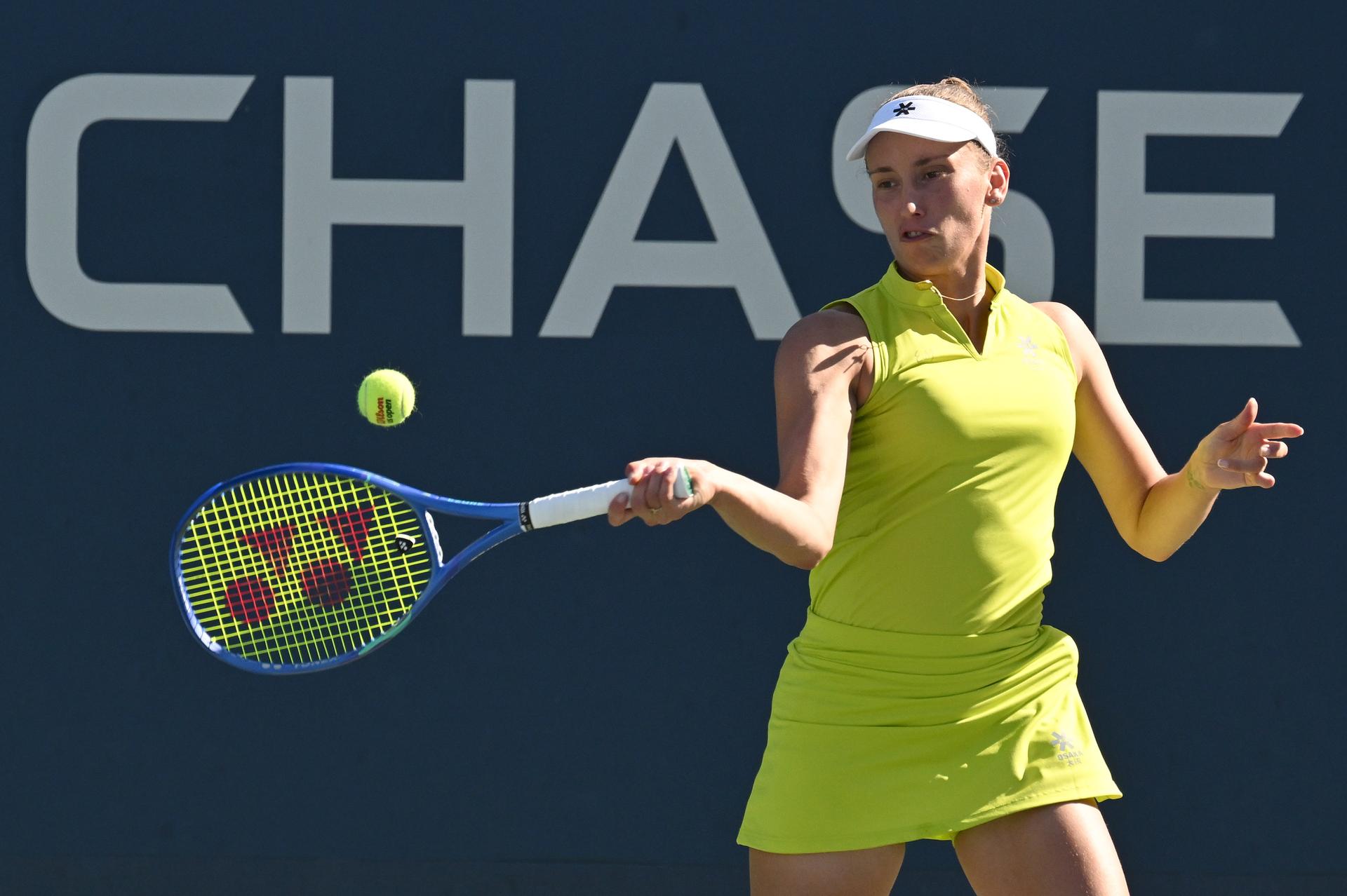 Belgian Elise Mertens (yellow) pictured during a tennis match with Kudermetova against US pair Brantmeier-Hamilton, in the second round of the women's doubles of the 2025 US Open Grand Slam tennis tournament in New York City, USA, Saturday 30 August 2025. BELGA PHOTO TONY BEHAR