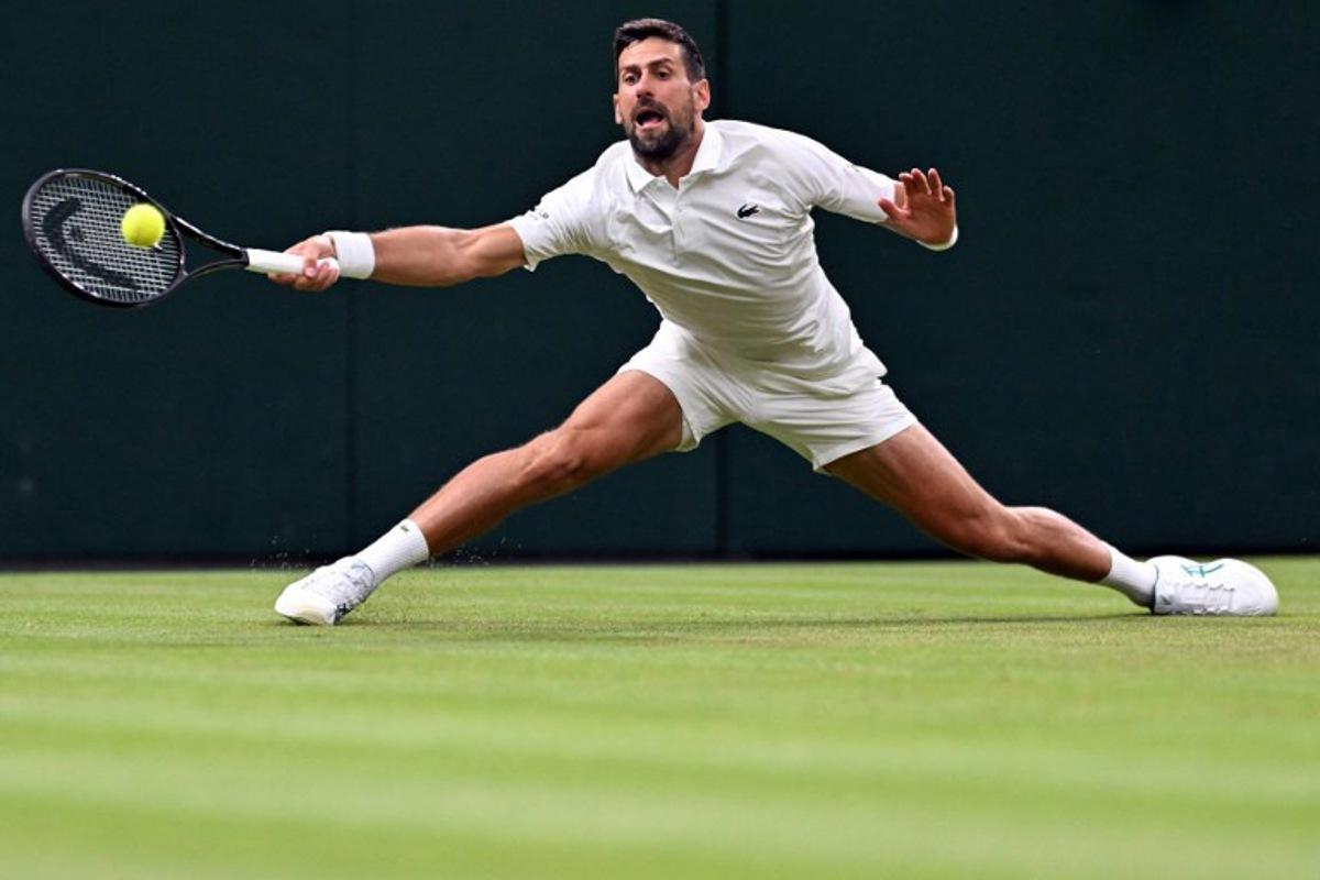 Serbia's Novak Djokovic returns the ball to Greece's Stefanos Tsitsipas during their men's singles second round tennis match on the third day of the 2026 Wimbledon Championships at The All England Lawn Tennis and Croquet Club in Wimbledon, southwest London, on July 1, 2026. Kirill KUDRYAVTSEV / AFP