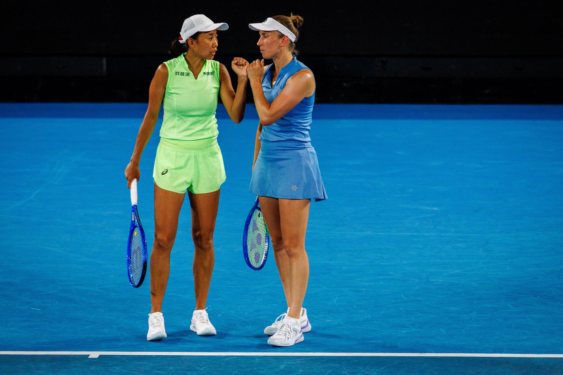 Belgium's Elise Mertens (blue) and Chinese Shuai Zhang (yellow) pictured during a tennis match between US pair Baptiste/Stearns and Belgian/ Chinese pair Mertens/Zhang, in the 1/8 final of the women doubles at the Australian Open, in Melbourne Park, Melbourne on Tuesday 27 January 2026. BELGA PHOTO PATRICK HAMILTON --- BENELUX ONLY ---
