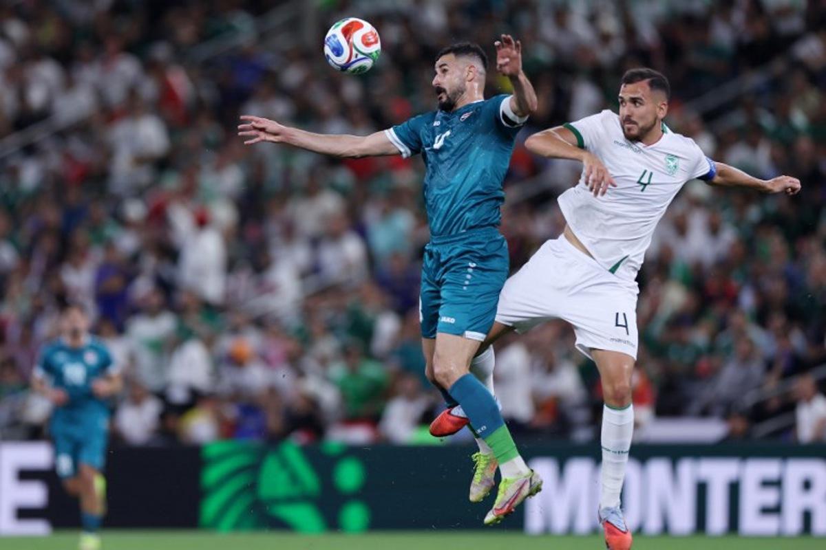 Iraq's forward #18 Aymen Hussein and Bolivia's defender #04 Luis Haquin fight for the ball during the 2026 FIFA World Cup qualifiers final playoff football match between Iraq and Bolivia at the BBVA Stadium in Guadalupe, Nuevo Leon state, Mexico, on March 31, 2026. Julio Cesar AGUILAR / AFP
